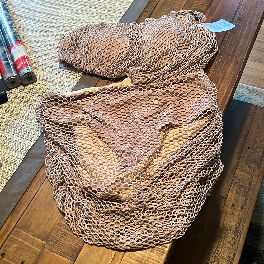 NWT one piece with flattering net overlay.